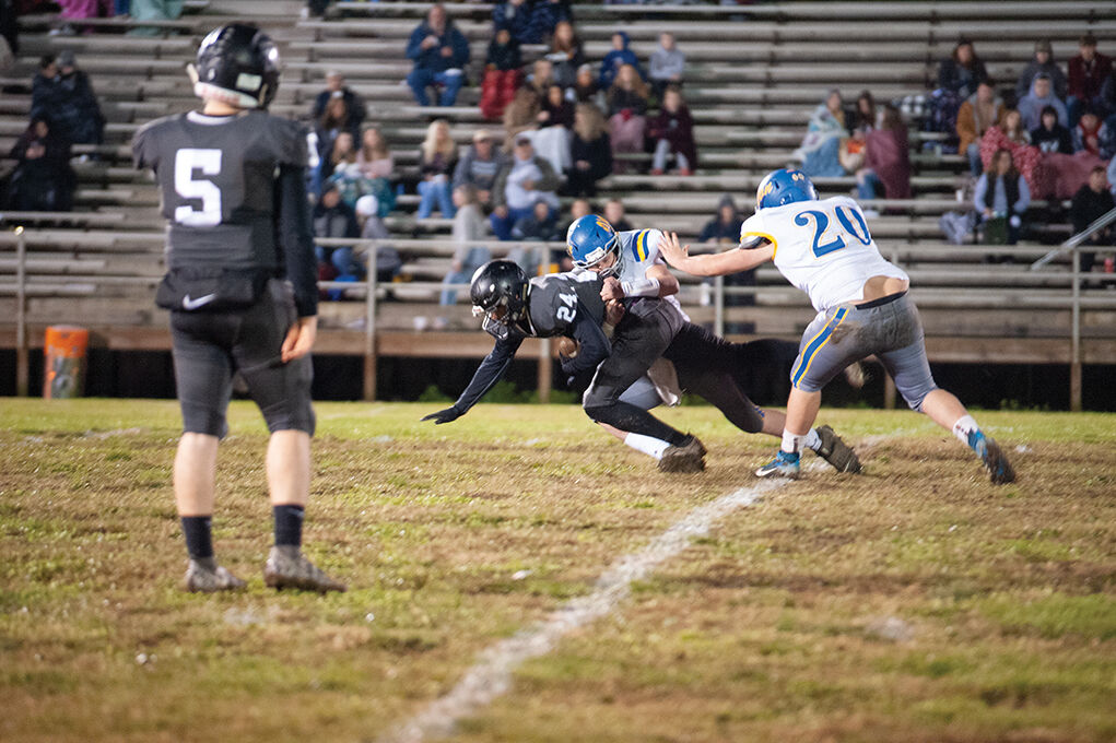 11-12 Dakota Oooten stretching for extra yardage.jpg